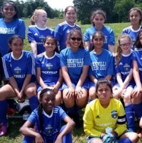 Girls' youth soccer team in blue uniforms