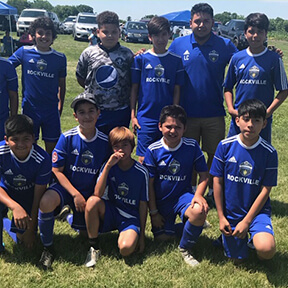 Young soccer players in blue Rockville jerseys