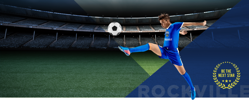 Soccer player kicking ball in stadium