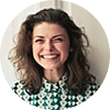 Smiling woman with curly hair headshot