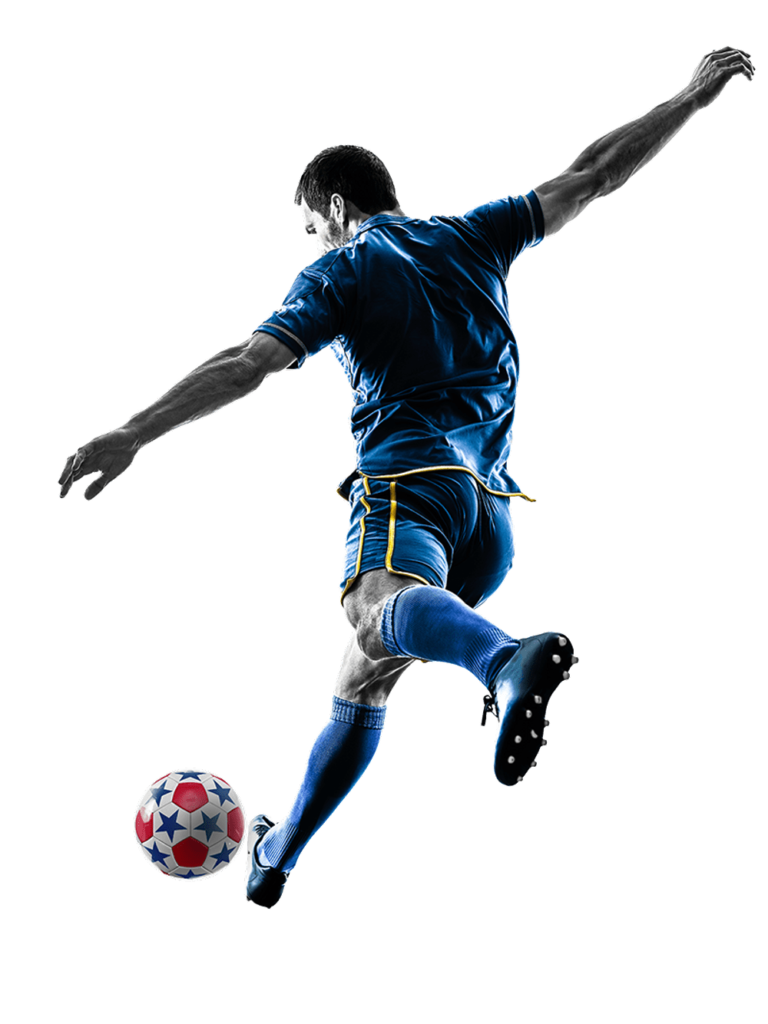 Soccer player midair kicking ball